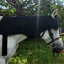 Horse wearing red and infrared light therapy poll cap and neck wrap for targeted poll and neck treatment